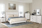 Gerridan King Panel Bed with Mirrored Dresser and Chest