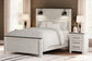 Schoenberg Queen Panel Bed with Mirrored Dresser, Chest and Nightstand