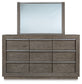 Anibecca California King Upholstered Bed with Mirrored Dresser, Chest and Nightstand